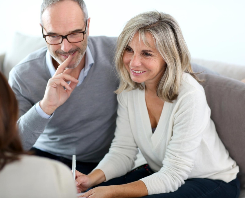 Senior couple meeting financial adviser for investment